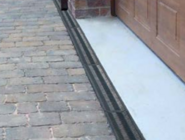 Fernco_lijngoot_afwatering_garagedeur